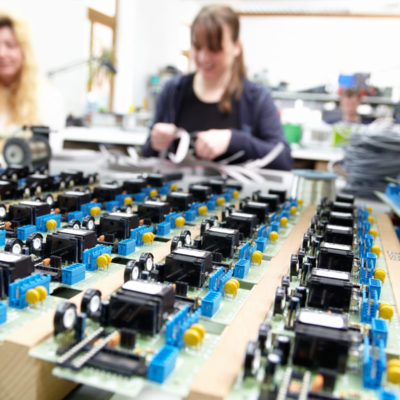 Women Populating Electronic Assemblies